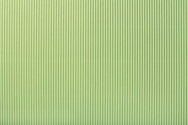 Texture of corrugated light green paper, macro.