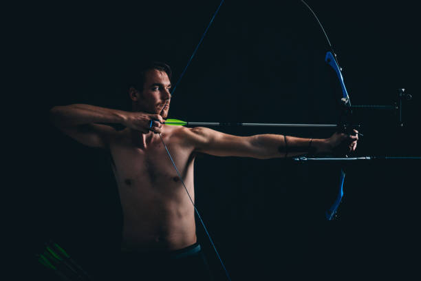 istock Young archer with the bow and arrow 1075315096