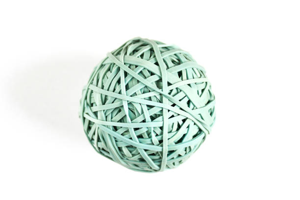 istock Close up blue aqua rubber band ball  on white isolated background 1075323664