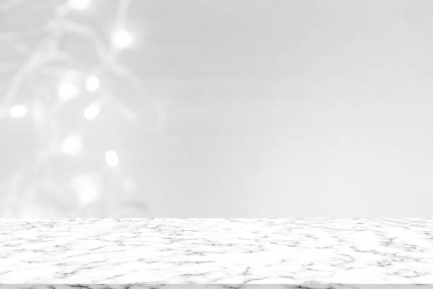 istock abstract blur luxury LED lamp bokeh light with white marble counter table top background texture for promote and show or advertise product on display concept 1075325508