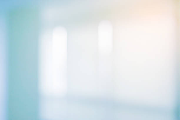 istock abstract blurred modern interior of office condominium background with night form glass reflection building for presentation , banner design 1075325524