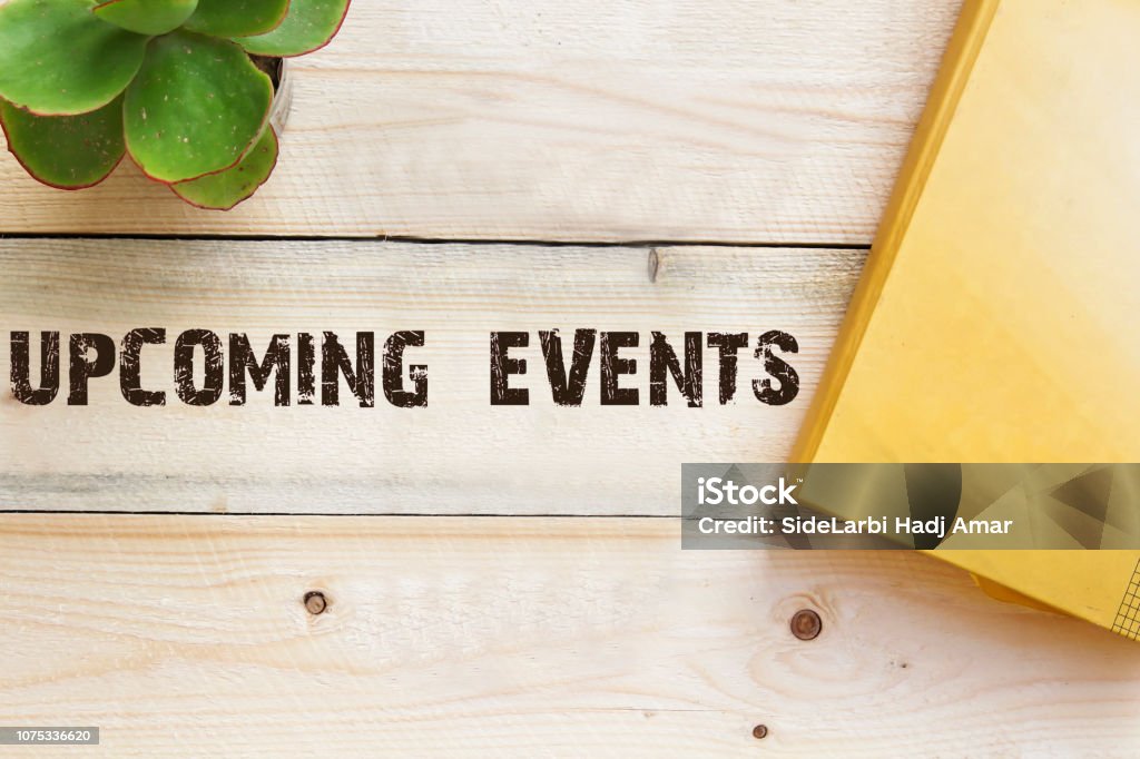 upcoming on wooden table concept Event Stock Photo