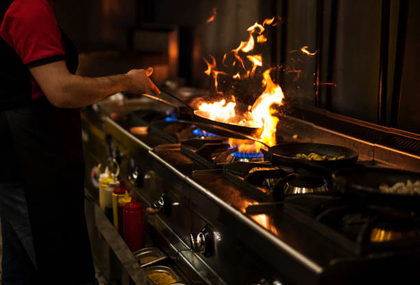 istock Chef flaming food at a restaurant 1075336702