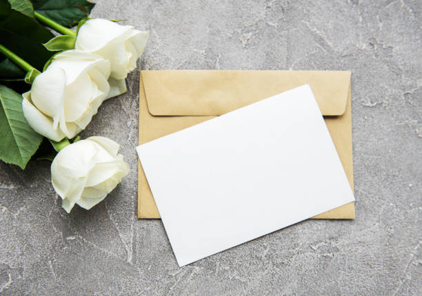 istock White roses and greeting card 1075345068