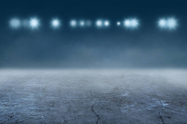 istock Concrete floor with white lamp spotlight for background 1075347112