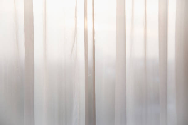 istock Defocused curtain window and stationery box with sunlight. 1075359270