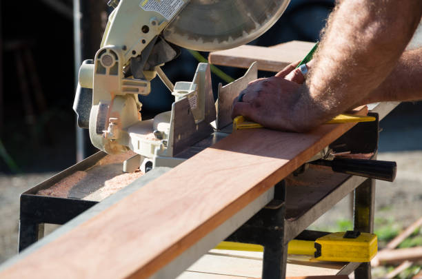 istock Man measuring a plank of wood 1075368478