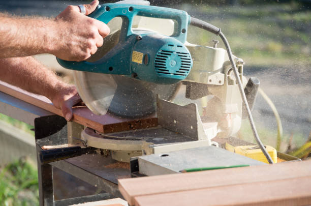 istock Man doing home renovations cutting wood with a saw 1075375162