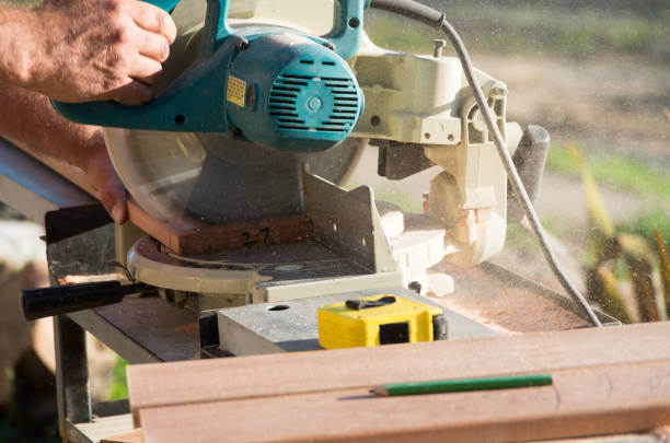 istock Man doing home renovations cutting wood with a saw 1075383306