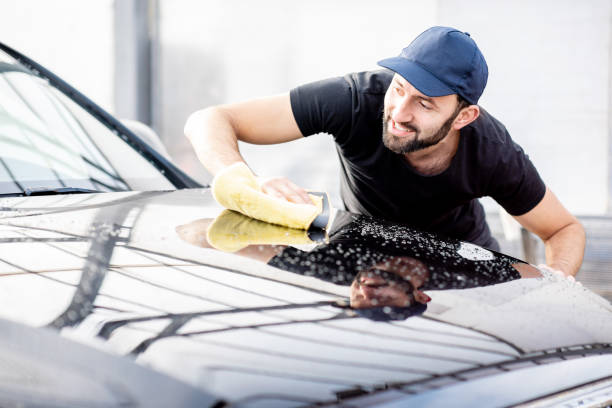 istock Professional washer wiping car hood 1075387964
