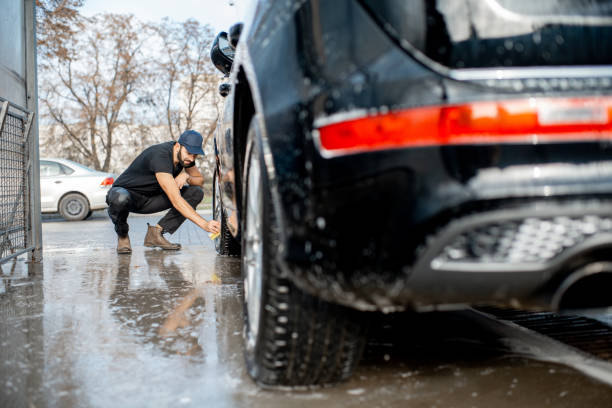 istock Washer wiping car wheel 1075388634