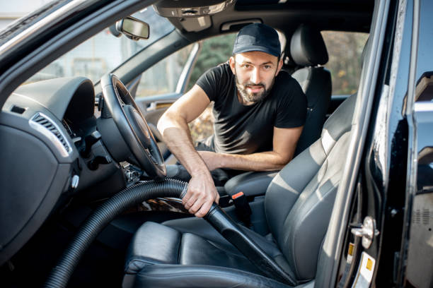 istock Cleaner vacuuming car seats 1075389268