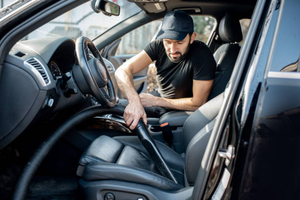 istock Cleaner vacuuming car seats 1075389306