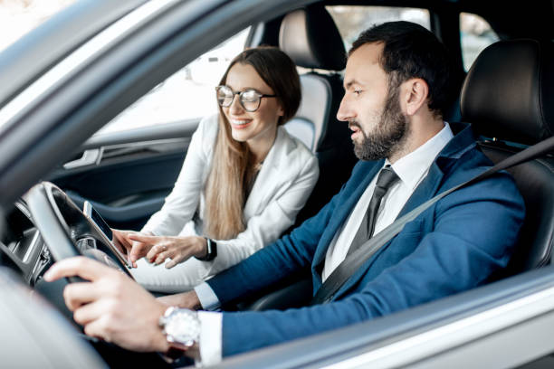 istock Business couple driving a car 1075397100