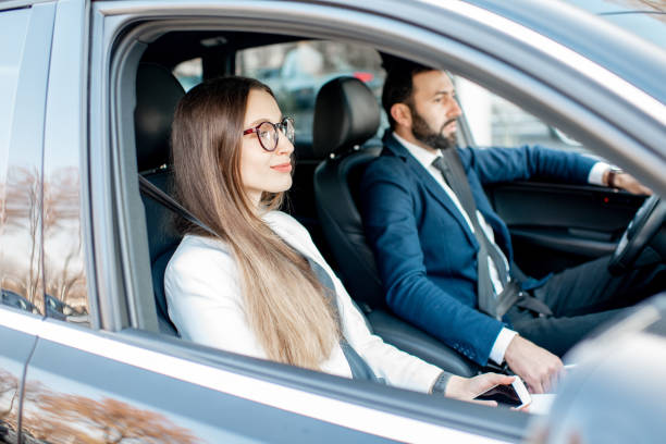 istock Business couple driving a car 1075397148