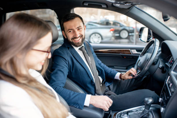 istock Business couple driving a car 1075397204