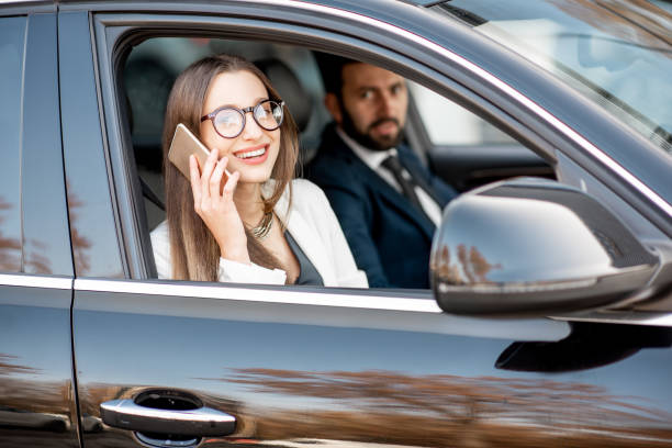 istock Business people driving a car 1075397428