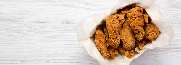 istock Tasty chicken wings, overhead view. Top view, from above. Copy space. 1075399962