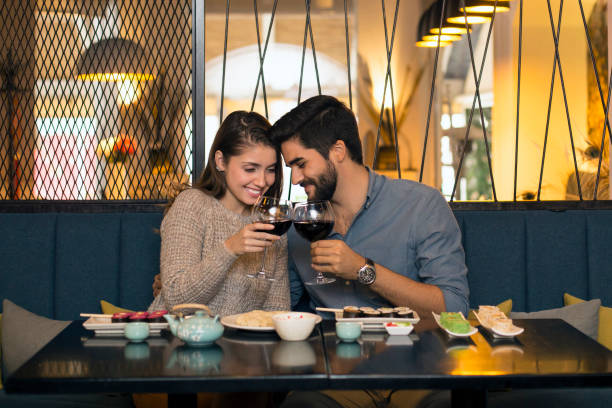 istock Young romantic couple in a restaurant 1075404000