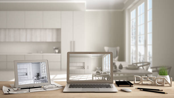 istock Architect designer concept, laptop and tablet on work desk with screen showing interior design project and CAD sketch, blurred draft in the background, classic kitchen with dining table 1075412148