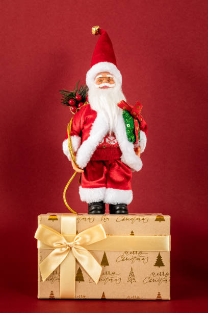 istock Santa Claus figure standing on a golden gift box 1075414876
