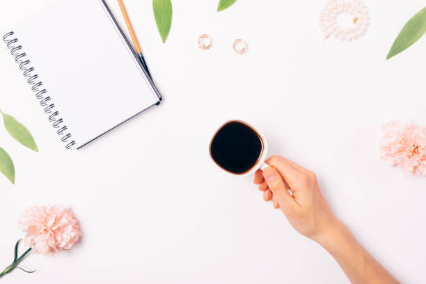 istock Woman's hand holding cup of black coffee 1075424646