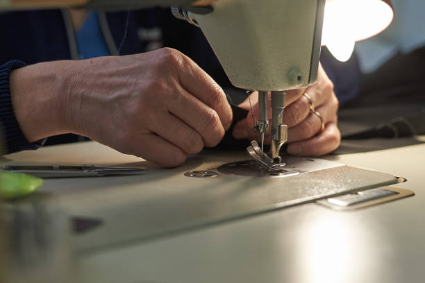 istock A woman sews on an electric sewing machine. 1075428414