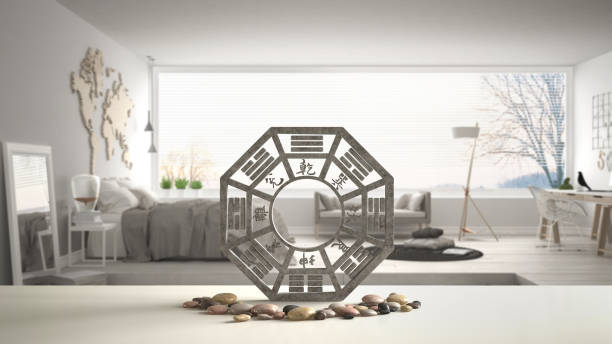 white table shelf with bagua and pebble stone, white scandinavian bedroom with big panoramic window, zen concept interior design, feng shui template idea background - fengshui imagens e fotografias de stock