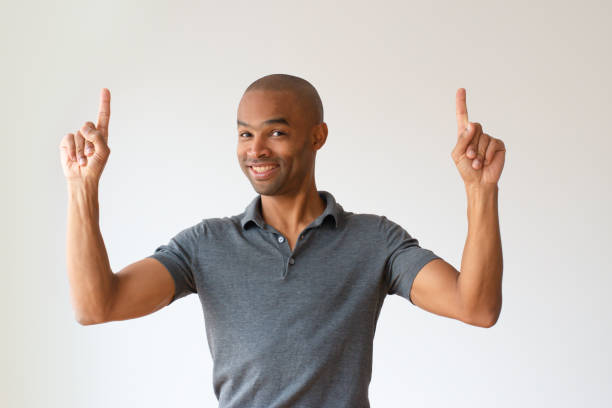 istock Emotional African American man having idea and pointing up 1075439548