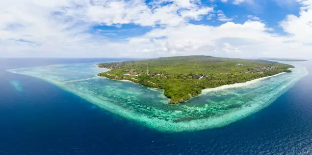 Aerial view tropical beach island reef caribbean sea. Indonesia Wakatobi archipelago, Tomia Island, marine national park. Top travel tourist destination, best diving snorkeling.