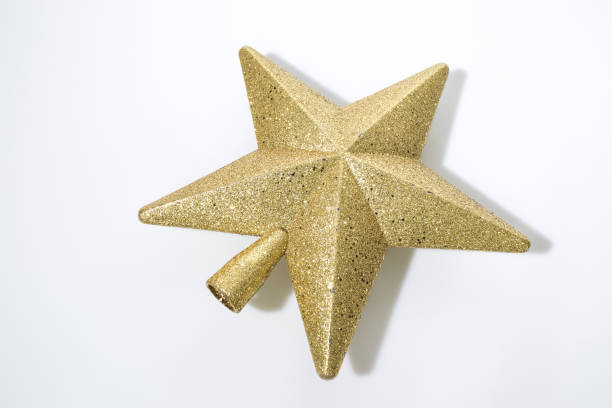 istock Gold christmas star isolated in a white background composition 1075443700