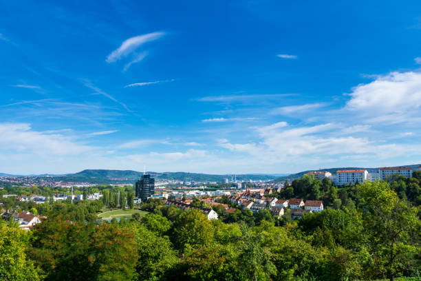 istock Germany, Stuttgart Killesberg houses between green trees from city park above 1075447476