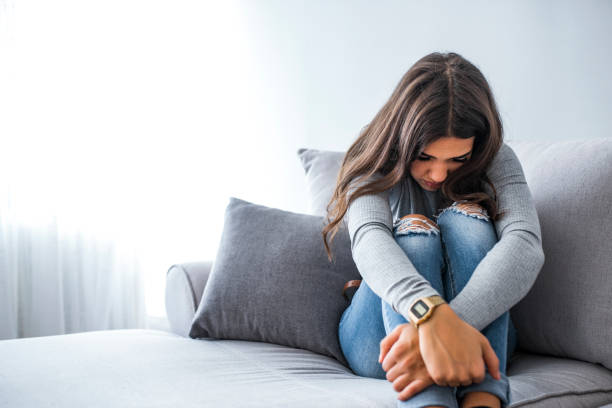 Young hopeless woman suffering from depression having nervous breakdown