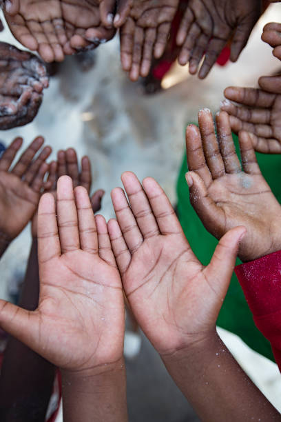 istock Pleading Hands of African Children 1075448298