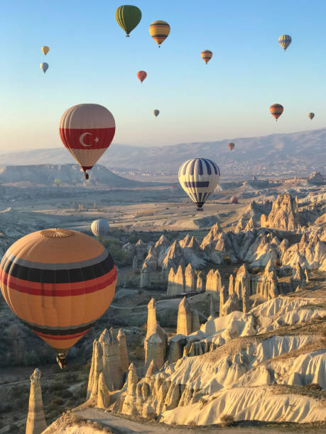 Flying over Cappadocia in a hot air balloon Flying over Cappadocia in a hot air balloon cappadocia photos stock pictures, royalty-free photos & images