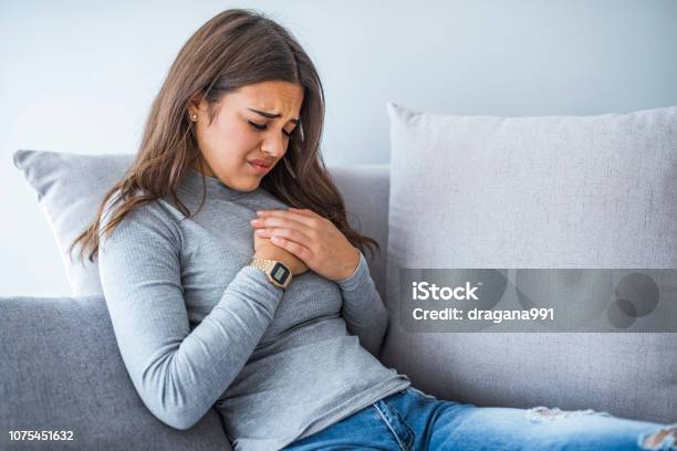 Sick Woman Having Bad Ache And Pain Heart Attack Health Problem Stock Photo - Download Image Now