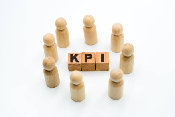 istock Wooden figures as business team in circle around acronym KPI Key Performance Indicator 1075456046