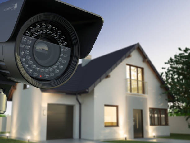 Security camera and house Home security system security system stock pictures, royalty-free photos & images