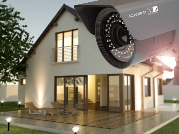 istock Security camera and house in the evening 1075473140