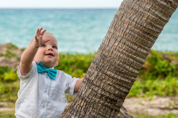 Young baby well-dressed for his parent's wedding ceremony by the beach of Varadero, Cuba.
