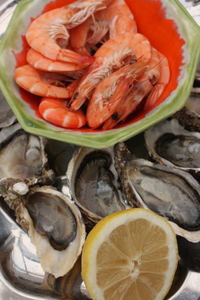 istock Gambas and Hollow oysters seasoned with lemon 1075484880