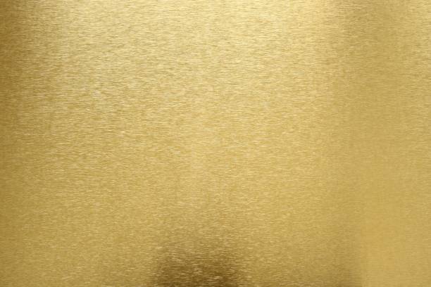 istock Texture of shiny old gold bar, abstract background, selective focus 1075489798