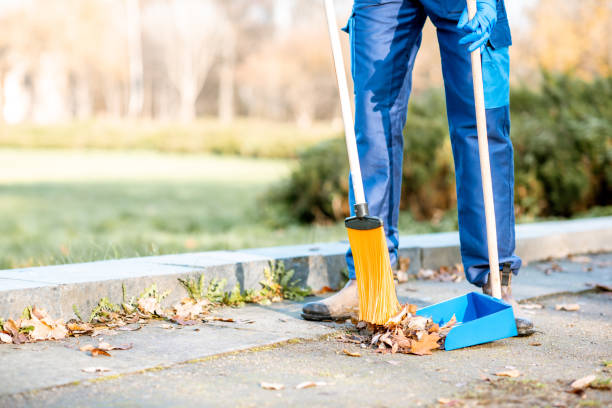 istock Sweeping leaves with broom and scoop 1075497754