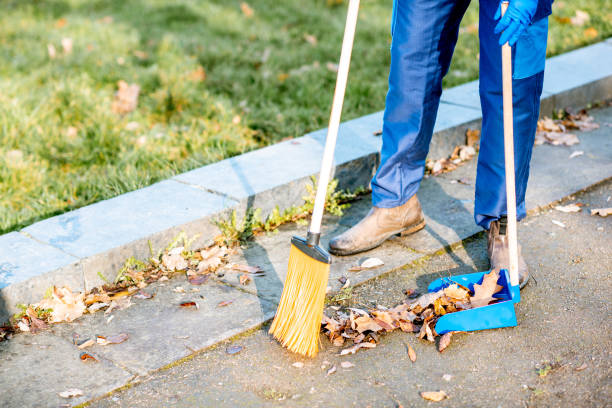istock Sweeping leaves with broom and scoop 1075497804
