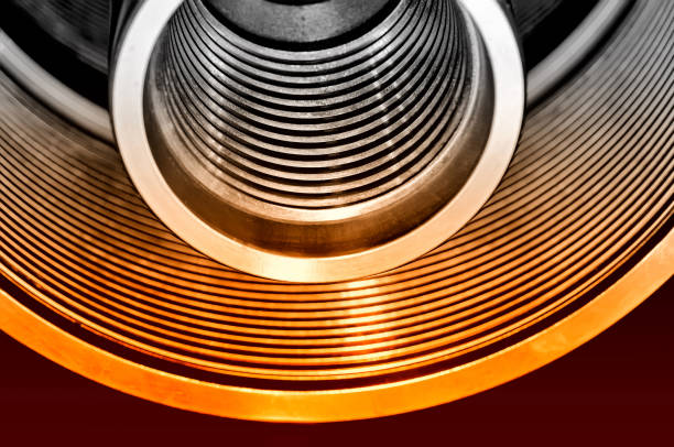 istock Steel tubes, cylinders with a screw thread. Red toned 1075501758