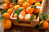 Fresh mandarin oranges fruit or tangerines in the wooden box