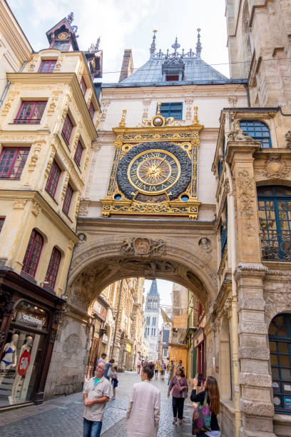 Pedestrian street of the Great Clock rue du Gros-Horloge . View of the Arch with the Big hours. Rouen, France Rouen, France - August 19, 2018: Pedestrian street of the Great Clock rue du Gros-Horloge . View of the Arch with the Big hours. The historical part of the city, filled with tourists. Rouen, France rue du gros horloge photos stock pictures, royalty-free photos & images