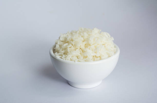 istock Jasmine rice in bowl on white background 1075508448