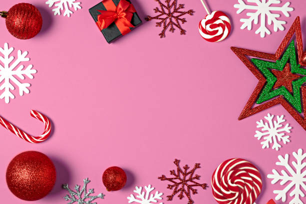 istock Christmas handmade gift boxes decorated with candy, star, white snowflakes on pink background top view. Merry christmas greeting card. Winter xmas holiday theme. Happy New Year 1075508744