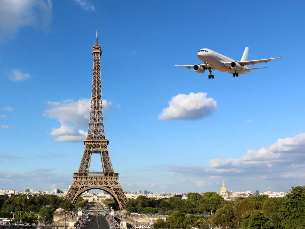 istock Eiffel Tower with Arriving Airplane 1075516884